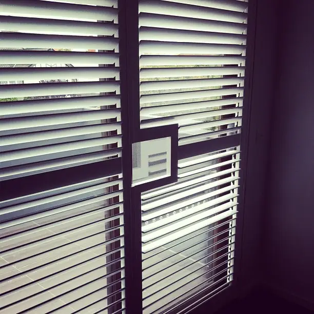 Door handle cutout in plantation shutters | InDesign Blinds InDesign Blinds