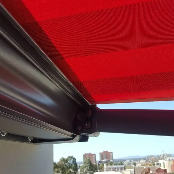 Another great installation of folding arm awning red anthracite. Using special spreader plates design.