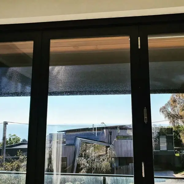 IndesignBlind's custom steel bracket installation for drop down screen blinds. Perfect fit.
